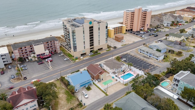 bird's eye view featuring a water view and a view of the beach