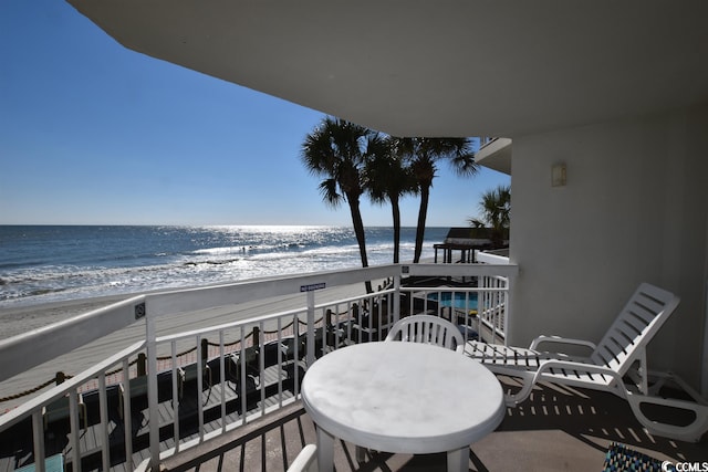 balcony featuring a water view