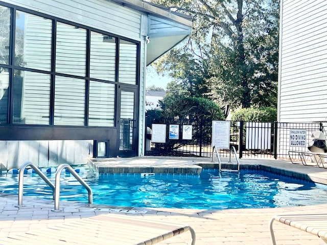 view of swimming pool featuring a patio