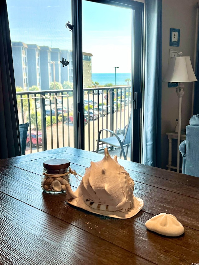 dining area featuring a water view