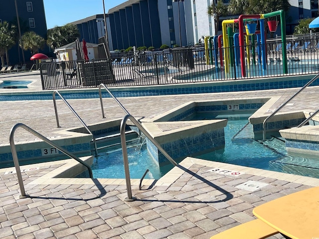 view of pool featuring a patio area