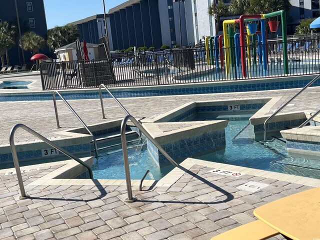 5905 S Kings Hwy Unit 337B, Myrtle Beach, SC 29575 - community pool featuring a community hot tub and a patio area