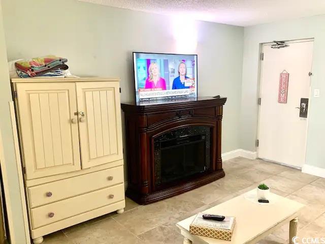 tiled living room with a textured ceiling