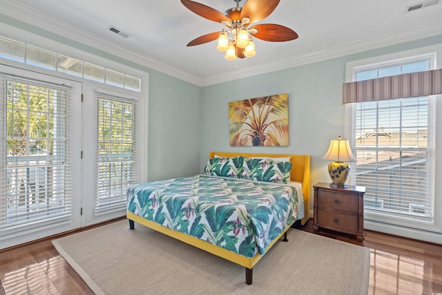 1010 Perrin Dr, North Myrtle Beach, SC 29582 - bedroom featuring access to outside, wood finished floors, crown molding, and a ceiling fan