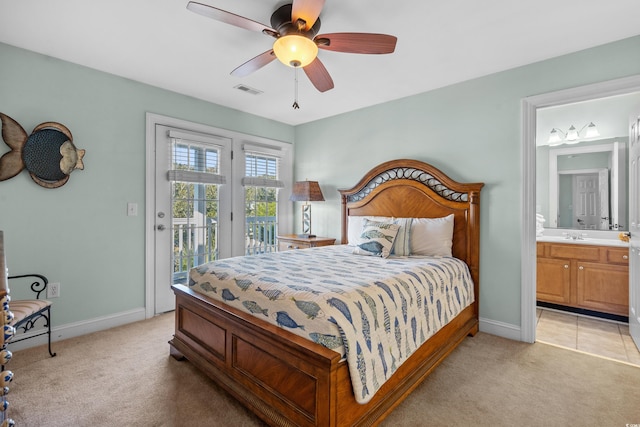 1010 Perrin Dr, North Myrtle Beach, SC 29582 - bedroom with light carpet, access to outside, baseboards, and ensuite bath