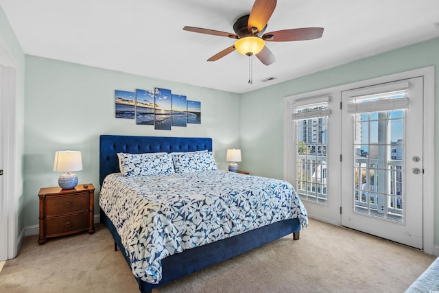 carpeted bedroom featuring access to outside and ceiling fan