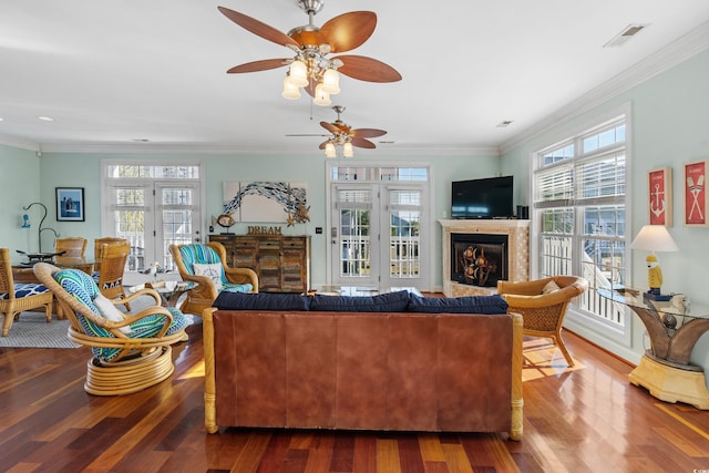 living room featuring a healthy amount of sunlight and hardwood / wood-style flooring