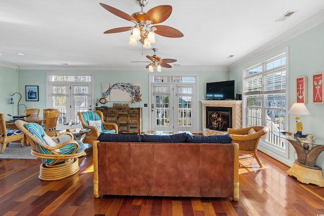 1010 Perrin Dr, North Myrtle Beach, SC 29582 - living room with a ceiling fan, a fireplace, dark wood-style floors, crown molding, and recessed lighting
