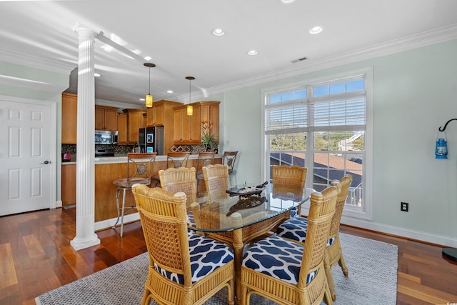 1010 Perrin Dr, North Myrtle Beach, SC 29582 - dining space featuring decorative columns, crown molding, recessed lighting, dark wood-type flooring, and baseboards