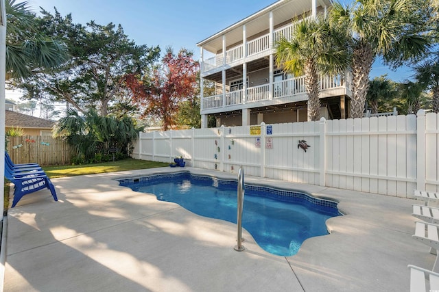 view of swimming pool with a patio area