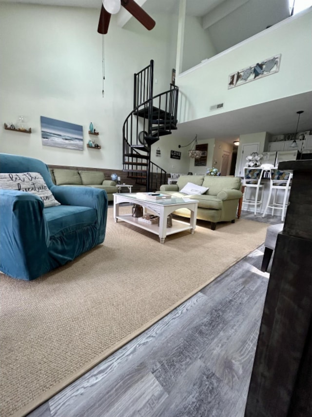 living room featuring beam ceiling, ceiling fan, high vaulted ceiling, and wood-type flooring