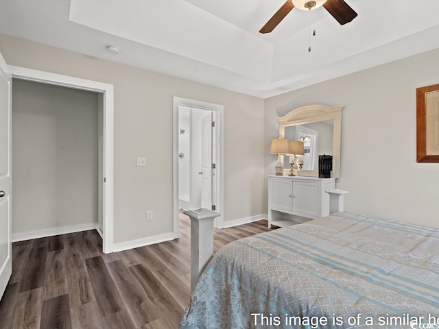 bedroom with ceiling fan and dark wood-type flooring