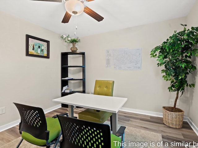 home office featuring wood-type flooring and ceiling fan