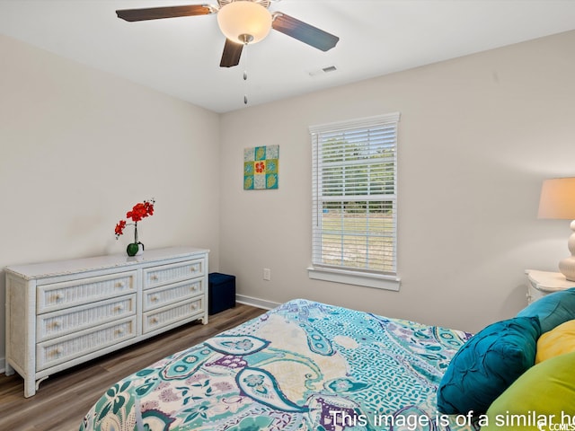 bedroom featuring dark hardwood / wood-style flooring and ceiling fan