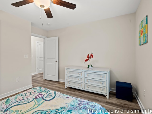 bedroom featuring ceiling fan and dark hardwood / wood-style floors