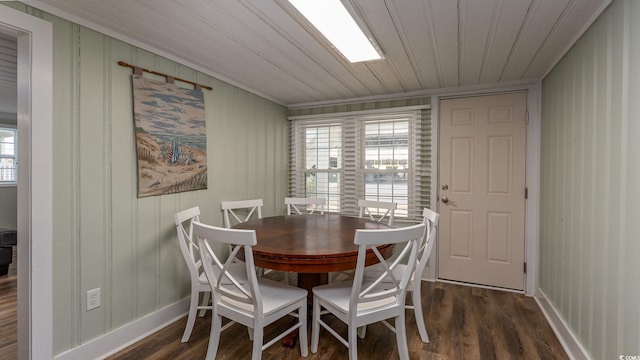 dining space with wooden ceiling, dark wood-style floors, and baseboards