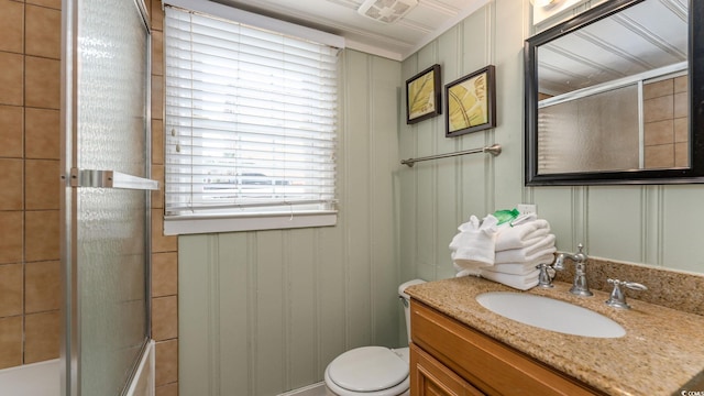 full bath featuring visible vents, bath / shower combo with glass door, vanity, and toilet