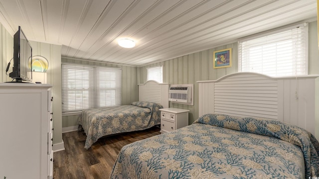 bedroom with wooden ceiling, dark wood-style flooring, and an AC wall unit