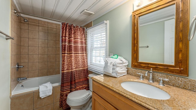 full bath with toilet, tiled shower / bath combo, visible vents, and vanity