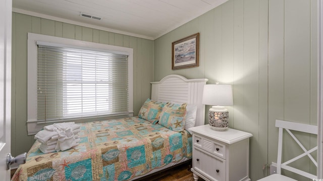 bedroom with visible vents and ornamental molding