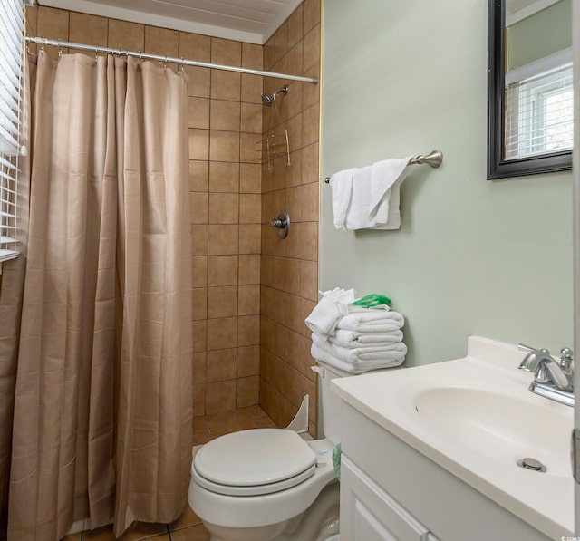 full bathroom featuring toilet, a stall shower, and vanity