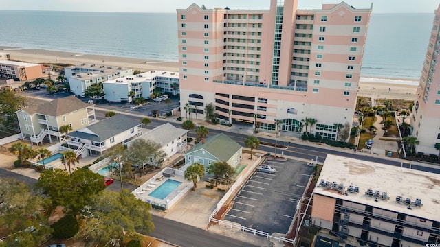 aerial view with a water view and a view of the beach