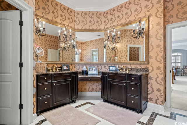 bathroom featuring ornamental molding, vanity, and an inviting chandelier