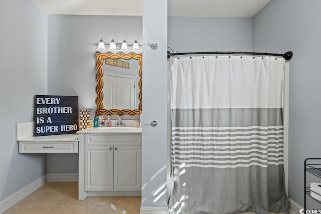 bathroom with vanity, curtained shower, and tile patterned floors