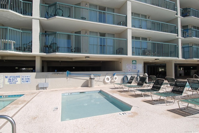 view of swimming pool featuring a patio area