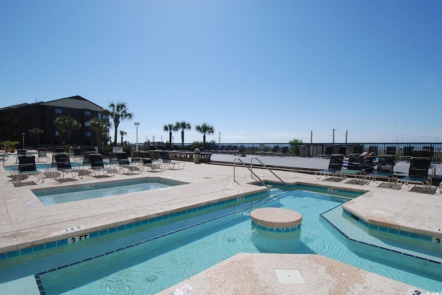 view of swimming pool featuring a patio