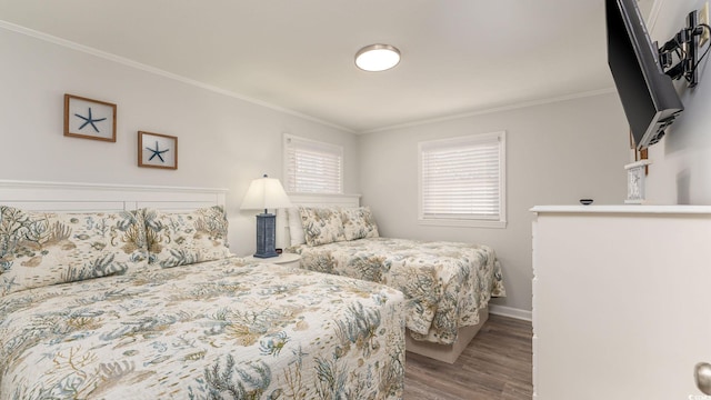 bedroom featuring crown molding and wood-type flooring