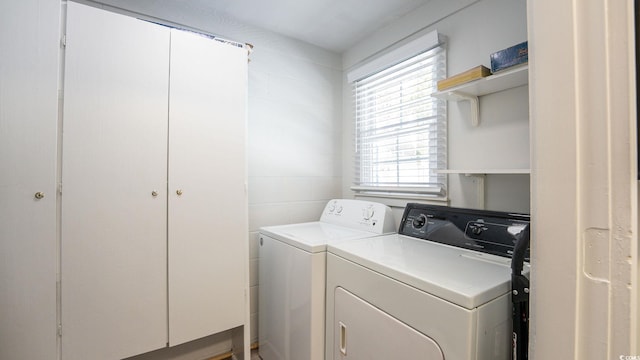 laundry area with washing machine and clothes dryer