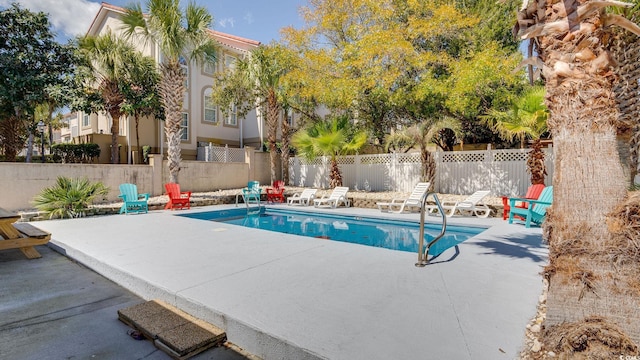 view of swimming pool with a patio area