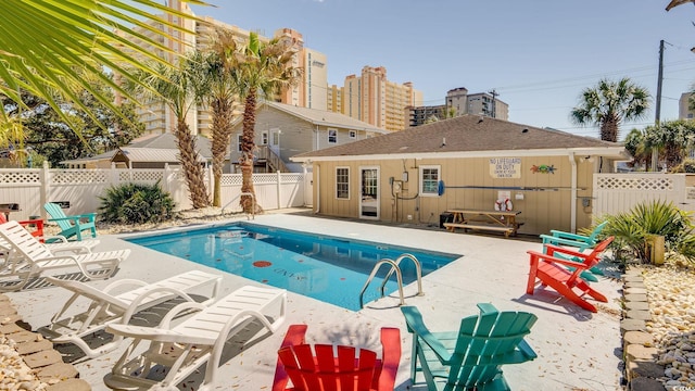 view of swimming pool with a patio area