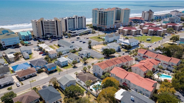 birds eye view of property with a view of city and a water view