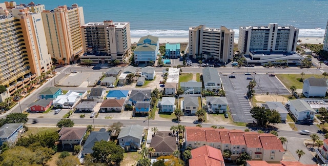 drone / aerial view featuring a water view and a city view