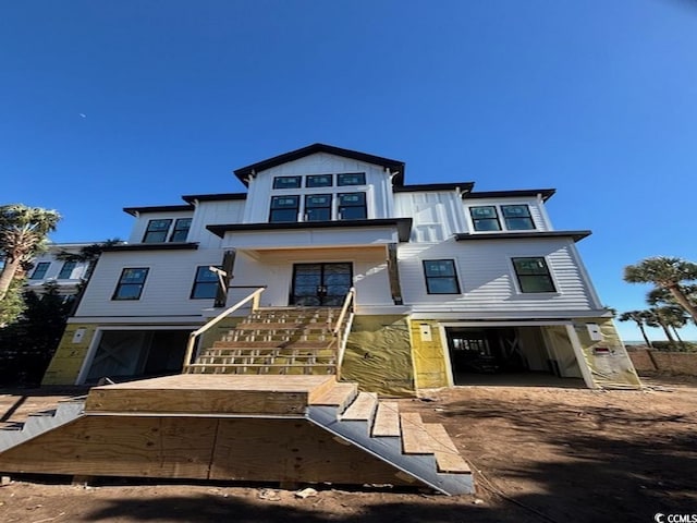 4300 N Ocean Blvd, Myrtle Beach, SC 29577 - view of front facade featuring stairway and an attached garage