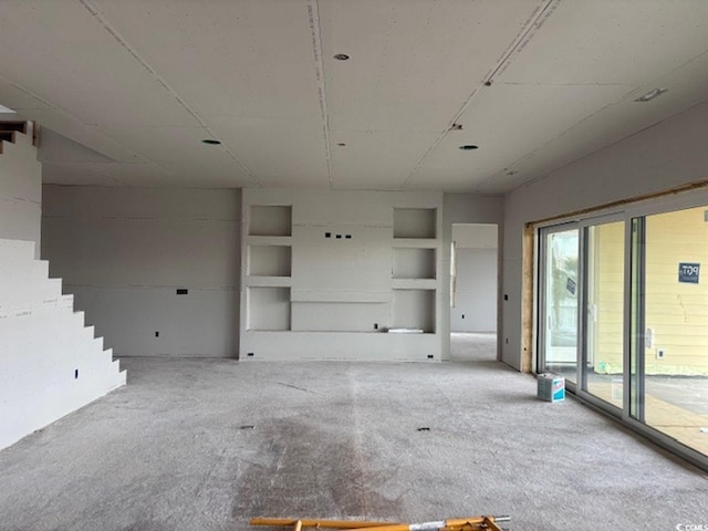 unfurnished living room with carpet floors