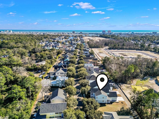 bird's eye view with a water view and a residential view