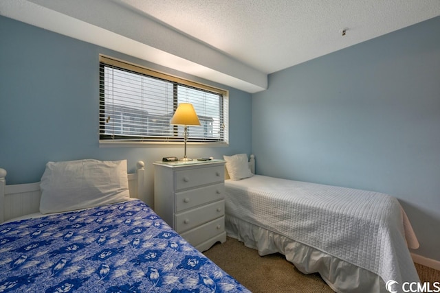 carpeted bedroom with a textured ceiling