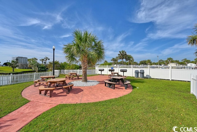 exterior space featuring a yard, fence, and a patio