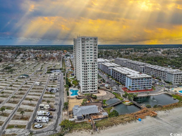 drone / aerial view with a view of city and a water view