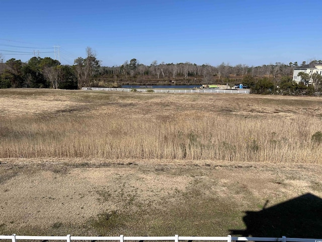 view of landscape with a water view