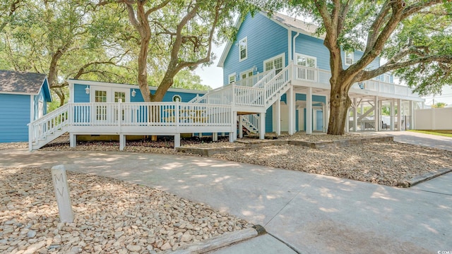 view of front facade featuring stairs and concrete driveway