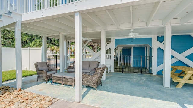 view of patio featuring fence and an outdoor living space