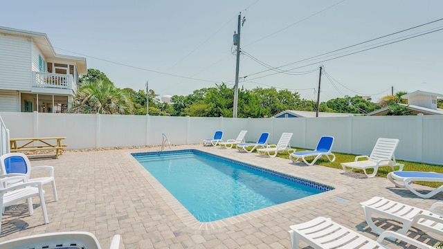 view of pool with a patio area, a fenced backyard, and a fenced in pool