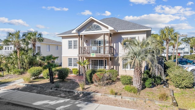 view of front of home with a balcony