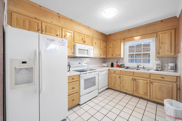 kitchen featuring light tile flooring, sink, white appliances, and tasteful backsplash