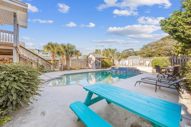 view of swimming pool featuring a patio area