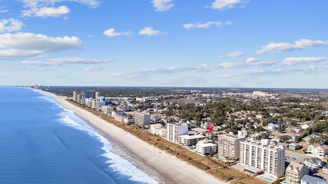 drone / aerial view with a beach view and a water view